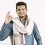 Happy smiling indian man showing ok hand sign Young Indian man in traditional wearing showing ok sign. White background.